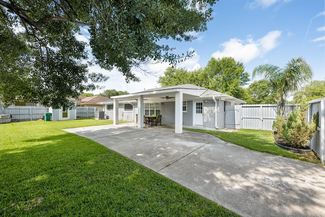 2701 Oaks Dr, Pasadena, TX 77502 - rear view of property with ceiling fan, a gate, driveway, a patio area, and brick siding