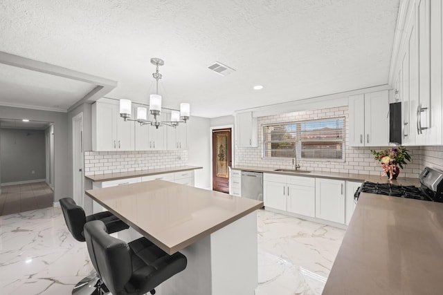 2701 Oaks Dr, Pasadena, TX 77502 - kitchen featuring dishwasher, light marble finish floors, decorative backsplash, gas range, and a chandelier