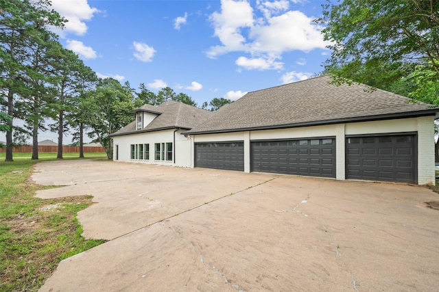 21310 Rosehill Church Rd, Tomball, TX 77377 - view of home's exterior featuring driveway, a shingled roof, and a garage