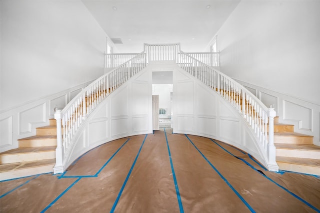 21310 Rosehill Church Rd, Tomball, TX 77377 - stairs with a decorative wall and a wainscoted wall