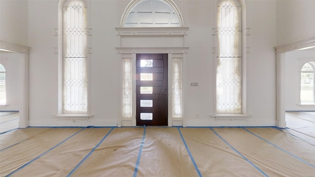 21310 Rosehill Church Rd, Tomball, TX 77377 - entryway featuring a towering ceiling and baseboards