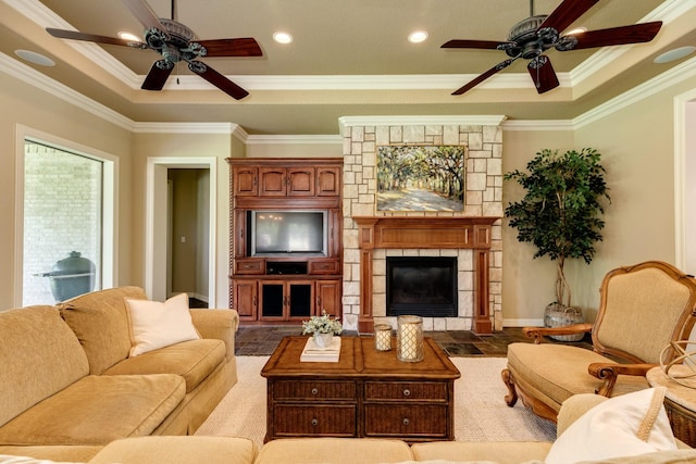 51 Northwood Ct, Lake Jackson, TX 77566 - living area with ceiling fan, a fireplace, ornamental molding, a raised ceiling, and recessed lighting