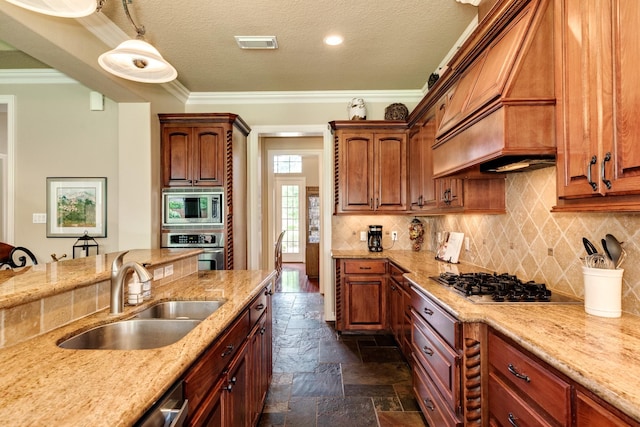 51 Northwood Ct, Lake Jackson, TX 77566 - kitchen featuring appliances with stainless steel finishes, a sink, stone tile floors, premium range hood, and ornamental molding