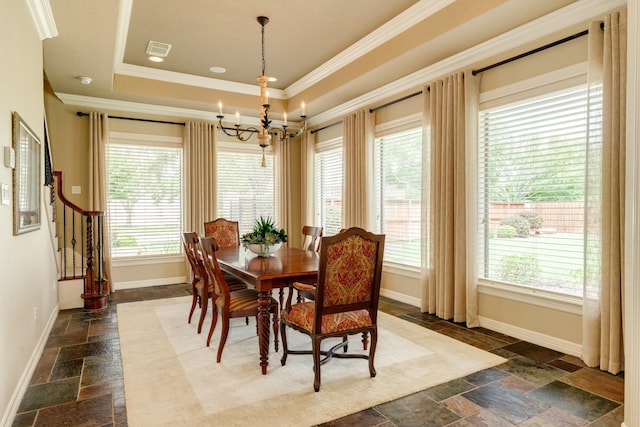 51 Northwood Ct, Lake Jackson, TX 77566 - dining area featuring stone tile floors, plenty of natural light, crown molding, baseboards, and a chandelier
