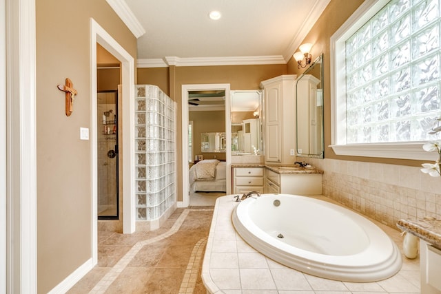 51 Northwood Ct, Lake Jackson, TX 77566 - bathroom with a garden tub, vanity, a shower stall, baseboards, and ornamental molding