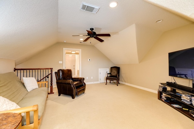 51 Northwood Ct, Lake Jackson, TX 77566 - living area featuring vaulted ceiling, a ceiling fan, carpet floors, baseboards, and a textured ceiling