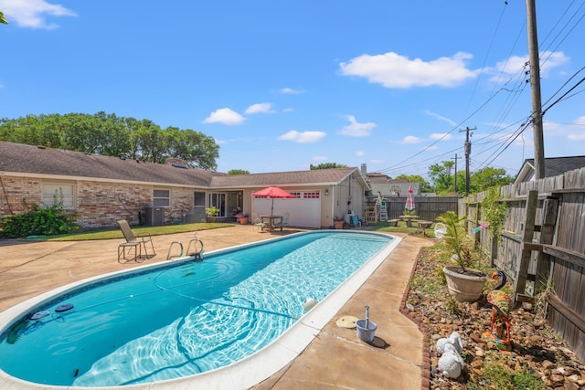 3026 Beluche Dr, Galveston, TX 77551 - view of pool featuring a patio and a fenced backyard