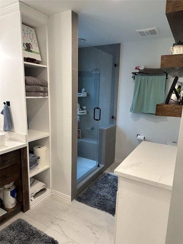 2044 Des Jardines St, Houston, TX 77023 - full bath with marble look tiles, a shower stall, vanity, and baseboards