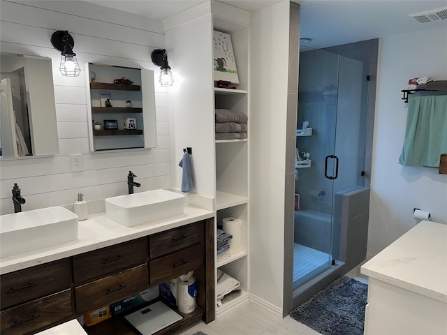 2044 Des Jardines St, Houston, TX 77023 - full bathroom featuring double vanity and a shower stall