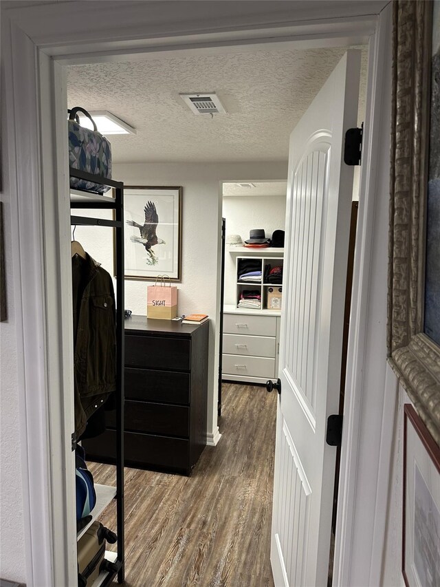 2044 Des Jardines St, Houston, TX 77023 - walk in closet with dark wood finished floors