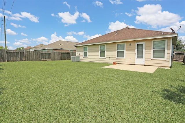 7027 Parkford Meadow Dr, Cypress, TX 77433 - back of property featuring a patio area, central AC unit, and roof with shingles