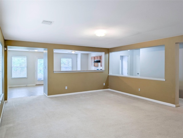 7027 Parkford Meadow Dr, Cypress, TX 77433 - empty room featuring light carpet and baseboards