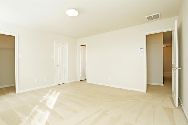 7027 Parkford Meadow Dr, Cypress, TX 77433 - unfurnished bedroom with light carpet, baseboards, and a spacious closet
