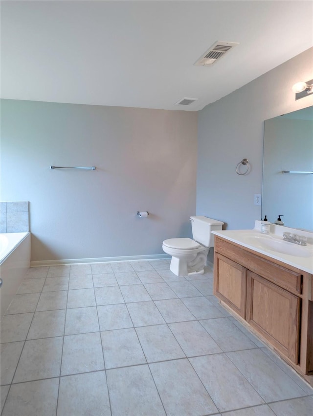 7027 Parkford Meadow Dr, Cypress, TX 77433 - bathroom featuring toilet, vanity, a bathtub, tile patterned floors, and baseboards