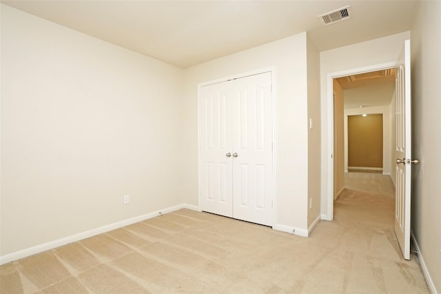 7027 Parkford Meadow Dr, Cypress, TX 77433 - unfurnished bedroom featuring light colored carpet, attic access, baseboards, and a closet