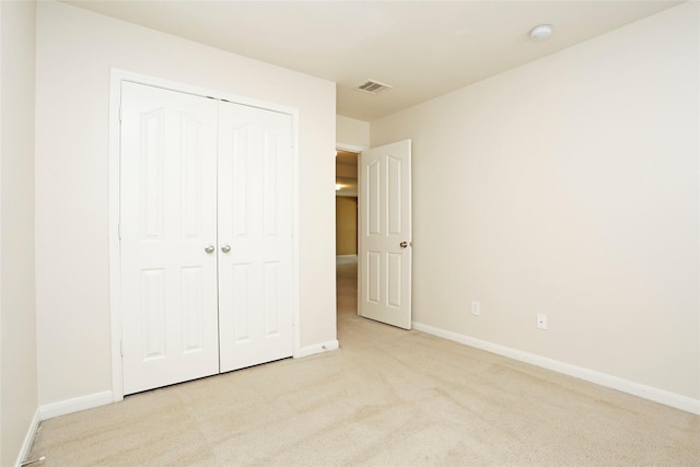 7027 Parkford Meadow Dr, Cypress, TX 77433 - unfurnished bedroom featuring light colored carpet, baseboards, and a closet