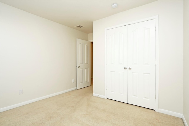 7027 Parkford Meadow Dr, Cypress, TX 77433 - unfurnished bedroom with light carpet, baseboards, and a closet