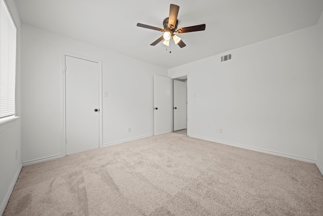 3500 Tangle Brush Dr Unit 48, The Woodlands, TX 77381 - unfurnished bedroom with carpet floors, baseboards, and ceiling fan