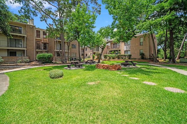 3500 Tangle Brush Dr Unit 48, The Woodlands, TX 77381 - view of property's community with a residential view and a yard