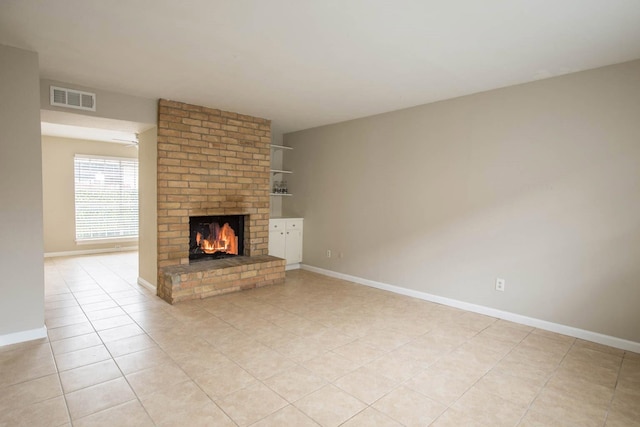 4064 Belle Park Dr Unit 4064, Houston, TX 77072 - unfurnished living room featuring a brick fireplace, light tile patterned floors, and baseboards