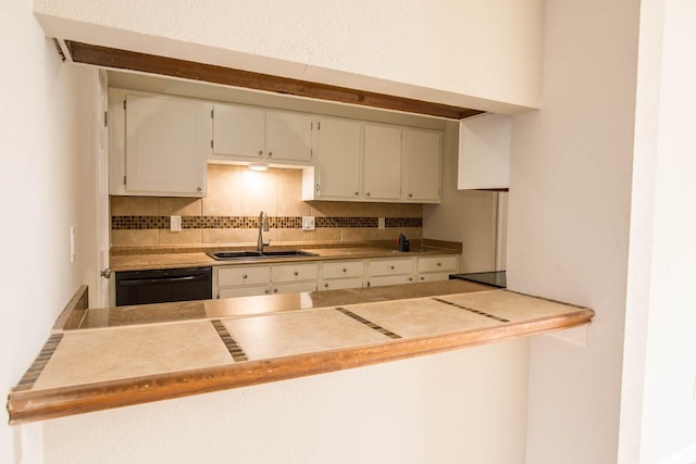 4064 Belle Park Dr Unit 4064, Houston, TX 77072 - kitchen featuring a sink, black dishwasher, decorative backsplash, and white cabinets