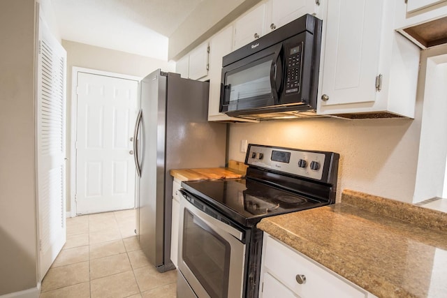 4064 Belle Park Dr Unit 4064, Houston, TX 77072 - kitchen featuring black microwave, stainless steel range with electric stovetop, white cabinetry, and light tile patterned floors