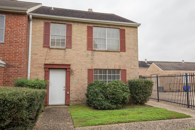 4064 Belle Park Dr Unit 4064, Houston, TX 77072 - view of front facade with brick siding and roof with shingles