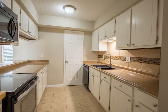 4064 Belle Park Dr Unit 4064, Houston, TX 77072 - kitchen featuring black microwave, electric stove, a sink, decorative backsplash, and white cabinetry