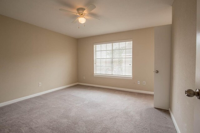 4064 Belle Park Dr Unit 4064, Houston, TX 77072 - empty room with light carpet, baseboards, and a ceiling fan