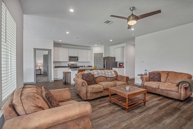 1709 Perch St, Alvin, TX 77511 - living room with dark wood-type flooring, baseboards, a ceiling fan, and recessed lighting