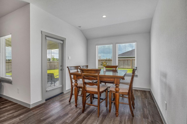 1709 Perch St, Alvin, TX 77511 - dining area with dark wood-type flooring, lofted ceiling, and baseboards