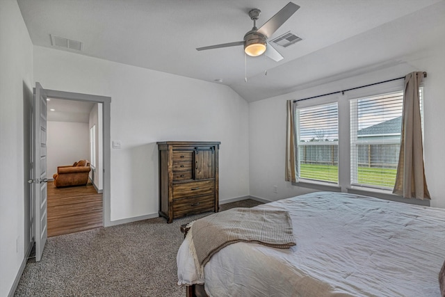 1709 Perch St, Alvin, TX 77511 - carpeted bedroom featuring lofted ceiling, baseboards, and ceiling fan