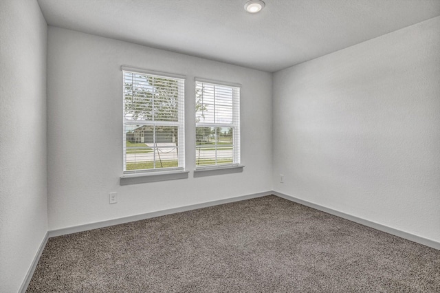 1709 Perch St, Alvin, TX 77511 - carpeted empty room with baseboards