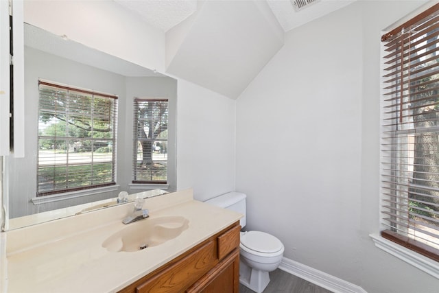 14651 Via Del Norte Dr, Houston, TX 77083 - half bath featuring toilet, vanity, wood finished floors, and baseboards