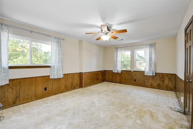 10902 Brentway Dr, Houston, TX 77070 - unfurnished room with wainscoting, wood walls, ceiling fan, and carpet