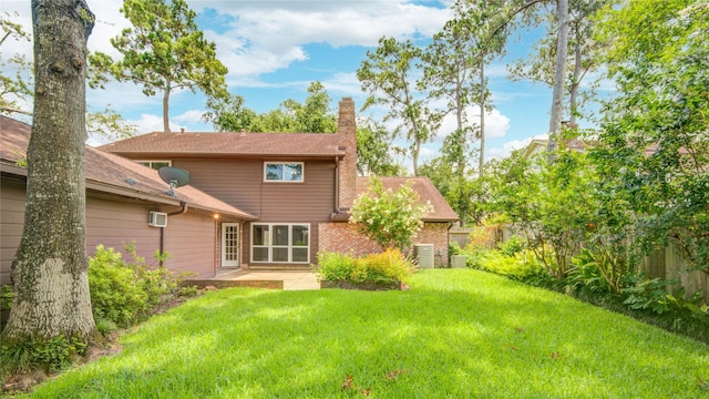 10902 Brentway Dr, Houston, TX 77070 - back of house with a chimney, a patio, and a wall mounted AC