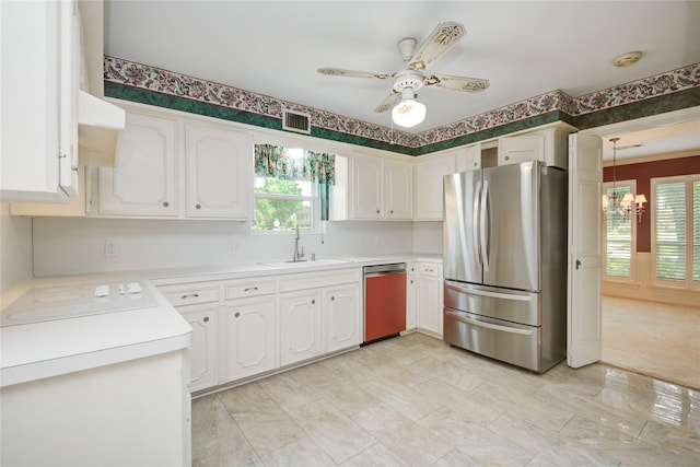 10902 Brentway Dr, Houston, TX 77070 - kitchen featuring freestanding refrigerator, dishwashing machine, white cabinetry, a chandelier, and ceiling fan