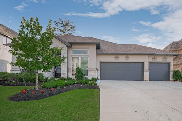 17414 Orchid Falls Ln, Conroe, TX 77302 - view of front facade with a garage, driveway, a front yard, stone siding, and stucco siding