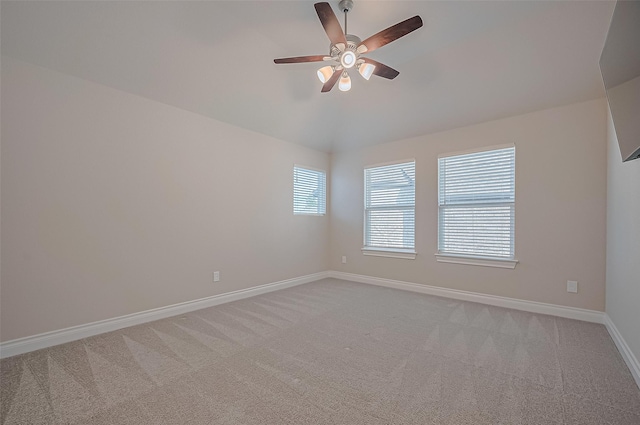 17414 Orchid Falls Ln, Conroe, TX 77302 - empty room featuring ceiling fan, light carpet, lofted ceiling, and baseboards