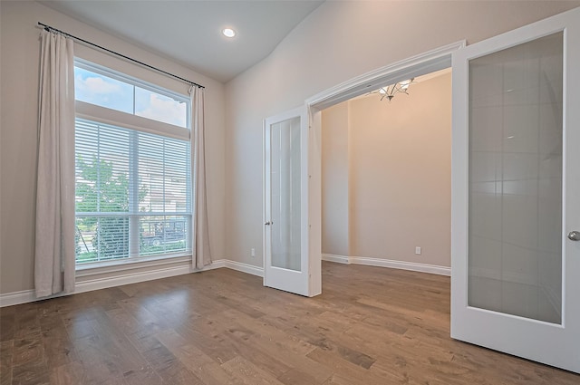 17414 Orchid Falls Ln, Conroe, TX 77302 - unfurnished room featuring baseboards, wood finished floors, and recessed lighting