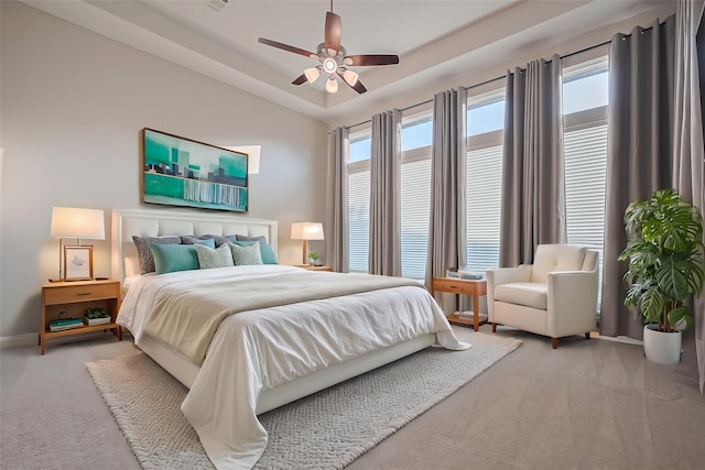 17414 Orchid Falls Ln, Conroe, TX 77302 - bedroom featuring carpet, baseboards, a ceiling fan, and a raised ceiling