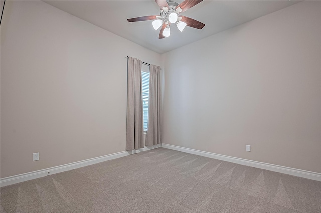 17414 Orchid Falls Ln, Conroe, TX 77302 - empty room featuring baseboards, light carpet, and ceiling fan