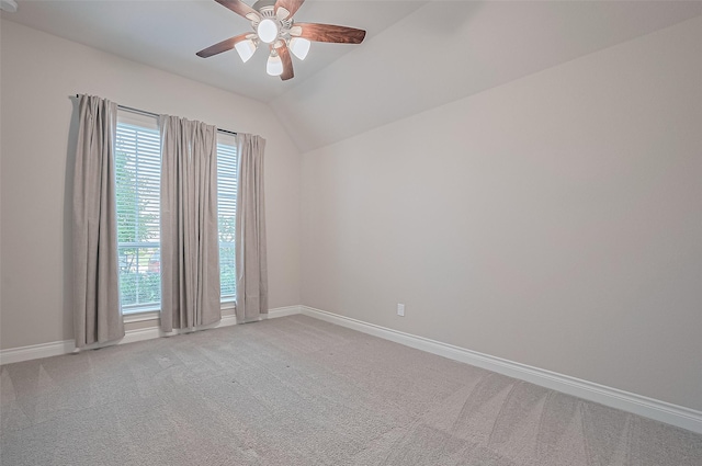 17414 Orchid Falls Ln, Conroe, TX 77302 - empty room with baseboards, a ceiling fan, light colored carpet, and vaulted ceiling