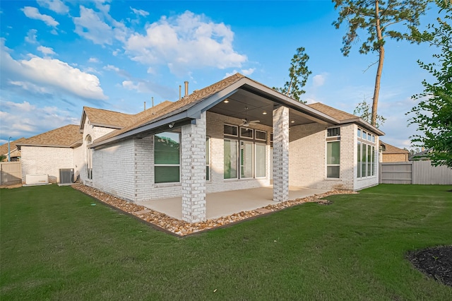 17414 Orchid Falls Ln, Conroe, TX 77302 - back of property with brick siding, a patio area, cooling unit, and roof with shingles