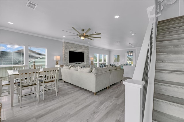 2336 Martinique, Crystal Beach, TX 77650 - living room featuring a ceiling fan, stairway, crown molding, recessed lighting, and light wood-style floors