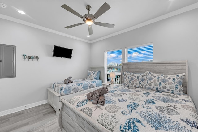 2336 Martinique, Crystal Beach, TX 77650 - bedroom featuring crown molding, wood finished floors, recessed lighting, baseboards, and a ceiling fan