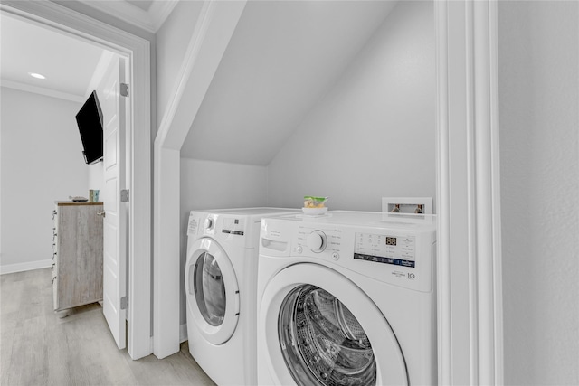 2336 Martinique, Crystal Beach, TX 77650 - laundry area featuring light wood-style flooring, separate washer and dryer, and ornamental molding