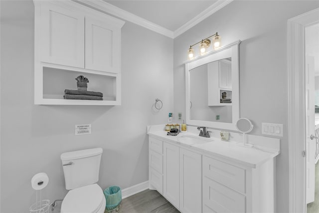 2336 Martinique, Crystal Beach, TX 77650 - bathroom with vanity, toilet, ornamental molding, baseboards, and wood finished floors