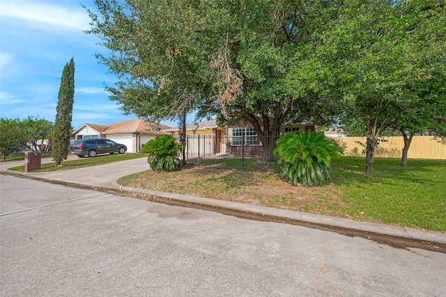 10111 Woodico Ct, Houston, TX 77038 - view of property hidden behind natural elements featuring concrete driveway and an attached garage