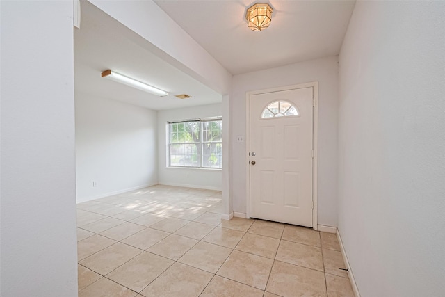 10111 Woodico Ct, Houston, TX 77038 - entrance foyer featuring light tile patterned floors and baseboards